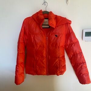 Salmon colored puffy jacket